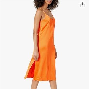 Satin midi slip dress. A slit on each side of the dress.